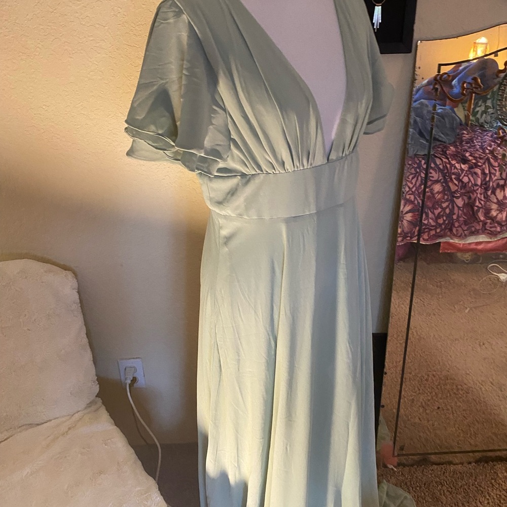 Sage green bridesmaids dress.